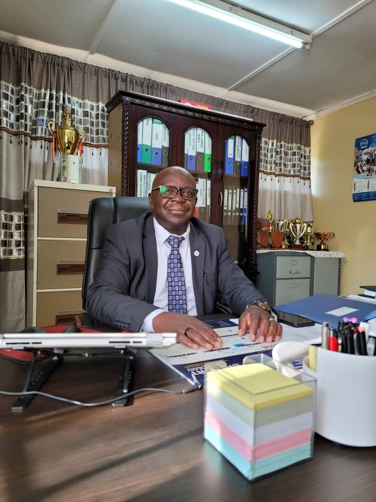 Dr. Ackim Kaunda, Head Teacher